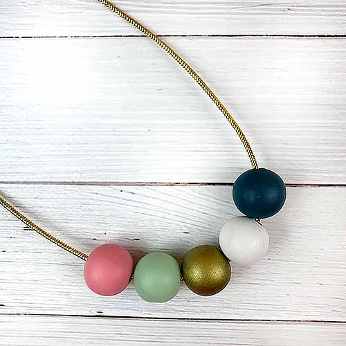 Pastel Beads on Gold Cord Necklace